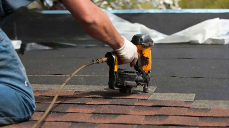 Roof repair technician working on a residential roof in Glendale, CA